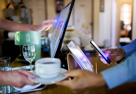 Restaurant team using point-of-sale technology